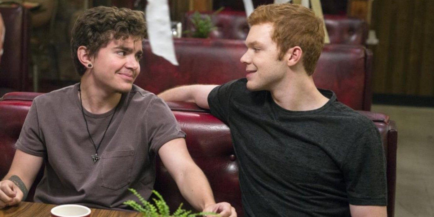 Ian and Trevor smiling at each other on Shameless.