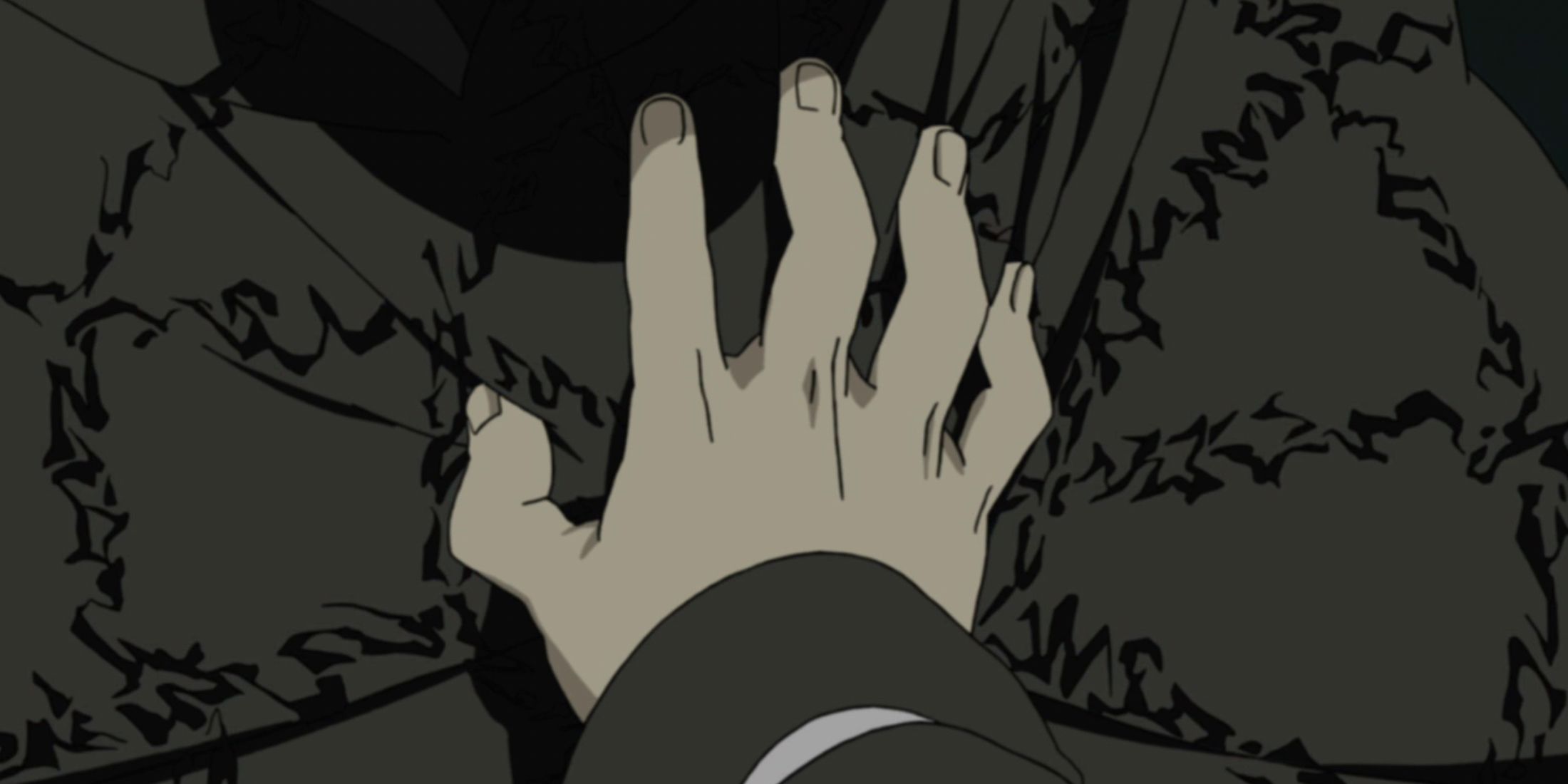 A hand covers a seal in Naruto