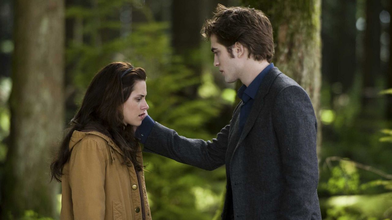 Edward touches Bella's face in the woods in New Moon