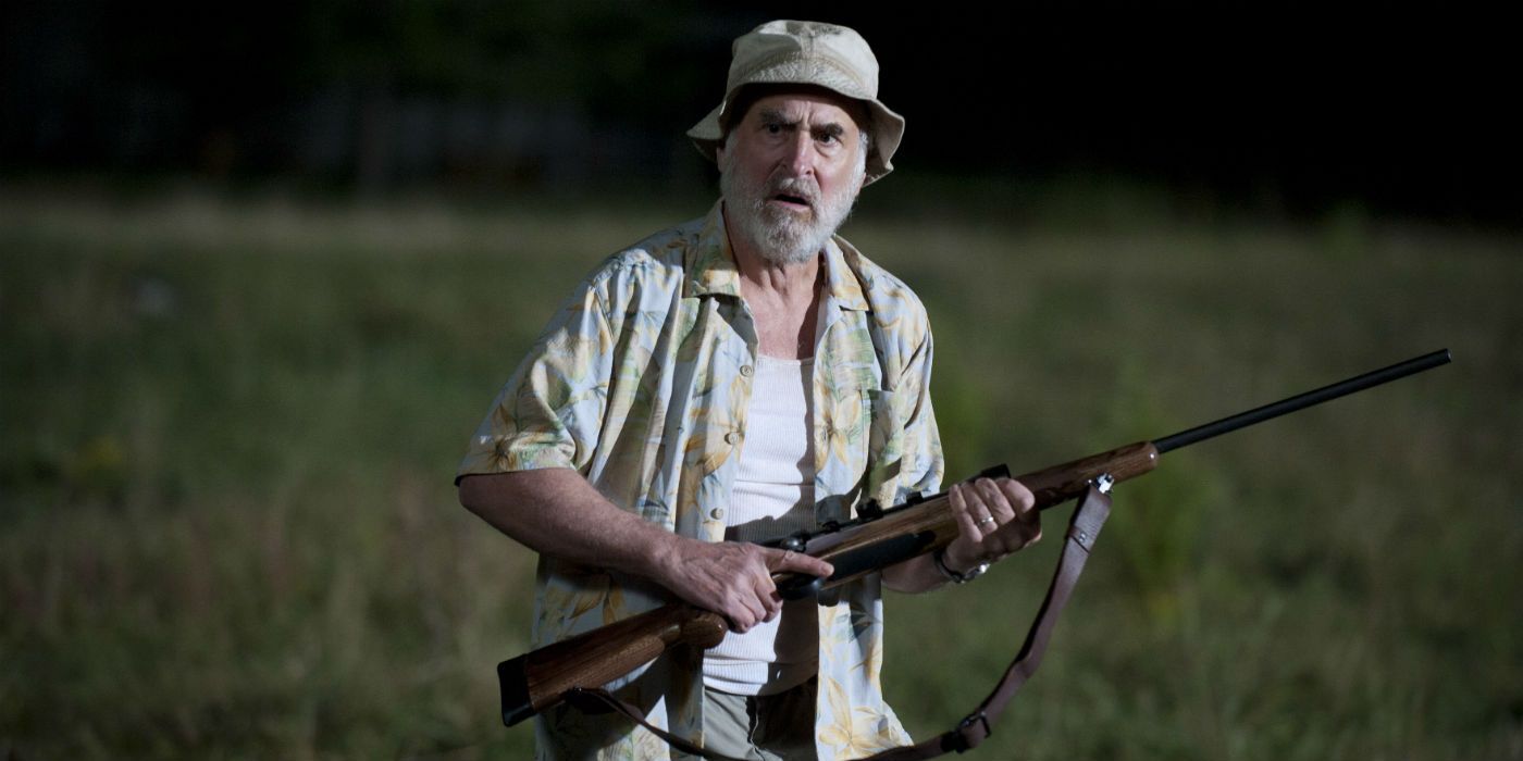 Dale holding a rifle in The Walking Dead. 