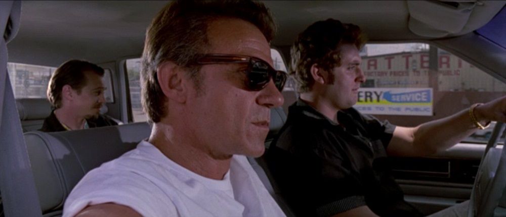 Mr. White, Mr. Pink and Eddy driving a car in Reservoir Dogs. 