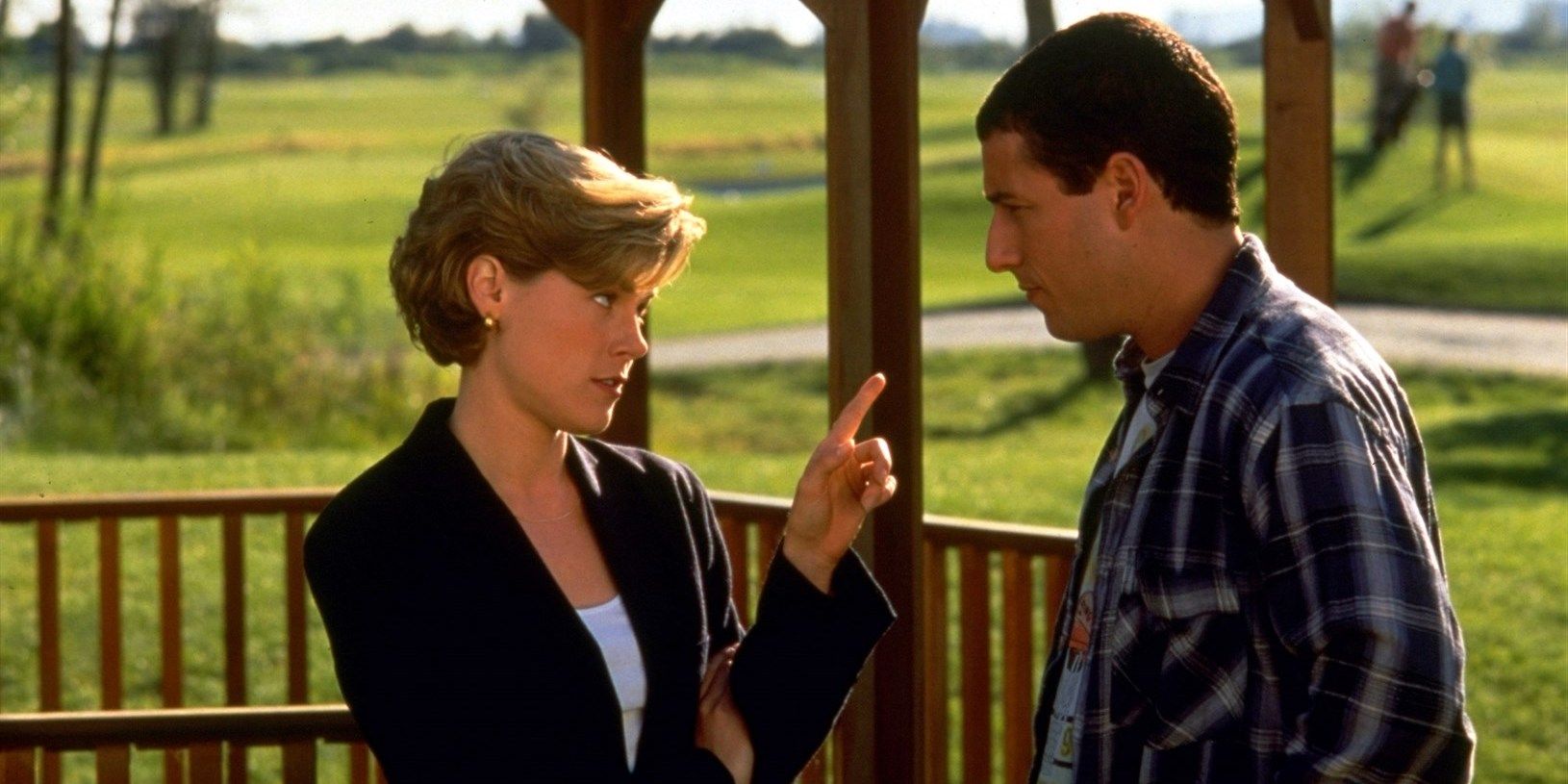 Julie Bowen as Virginia Venit pointing at Happy by a gazebo on the golf course in Happy Gilmore