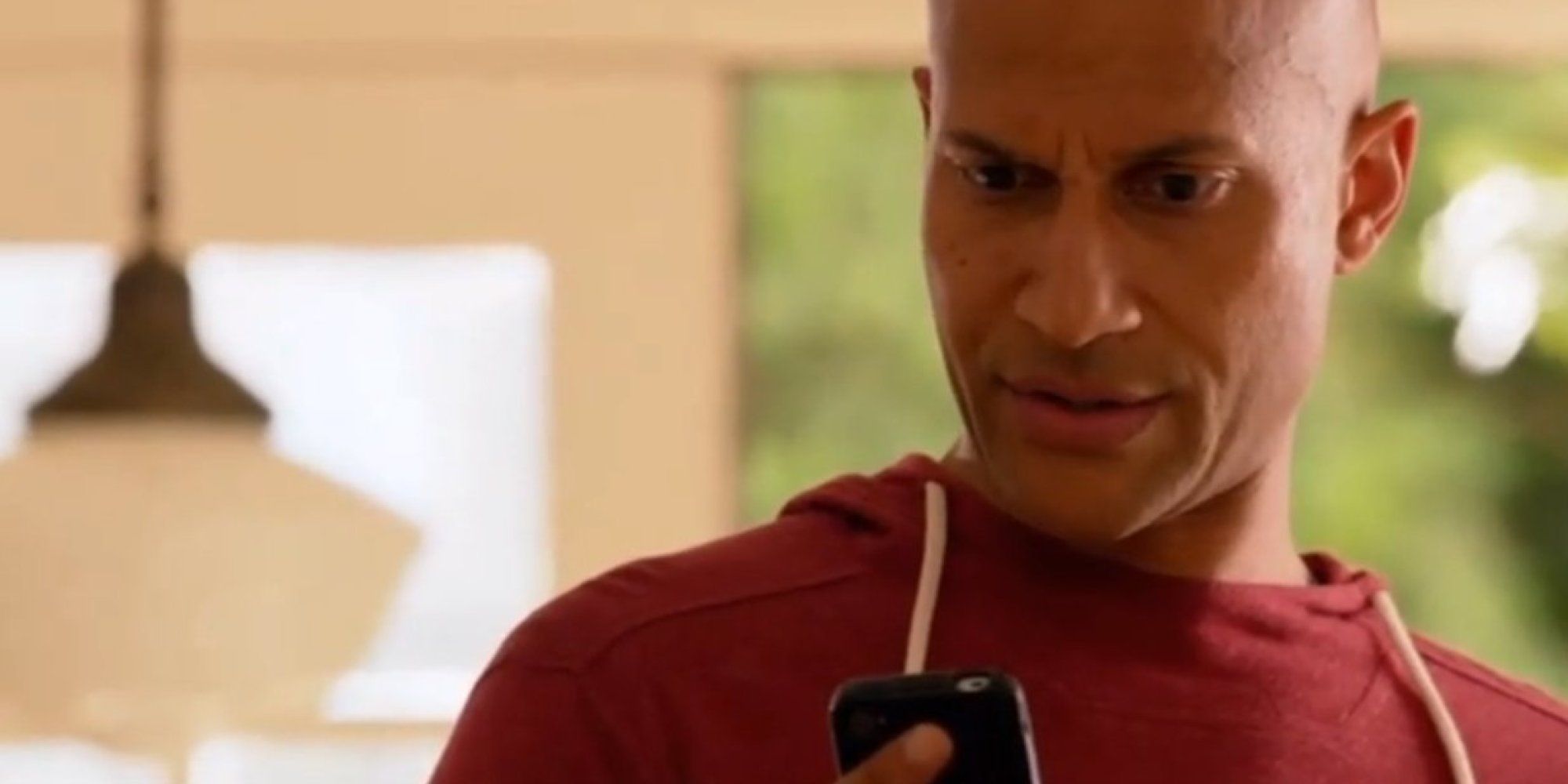Key looks confused at a text in Key and Peele