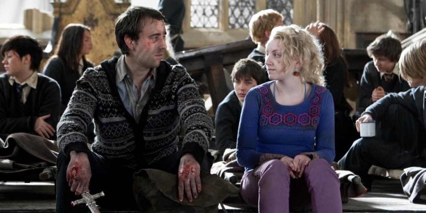 Luna and Neville sitting together after the Battle of Hogwarts in Harry Potter