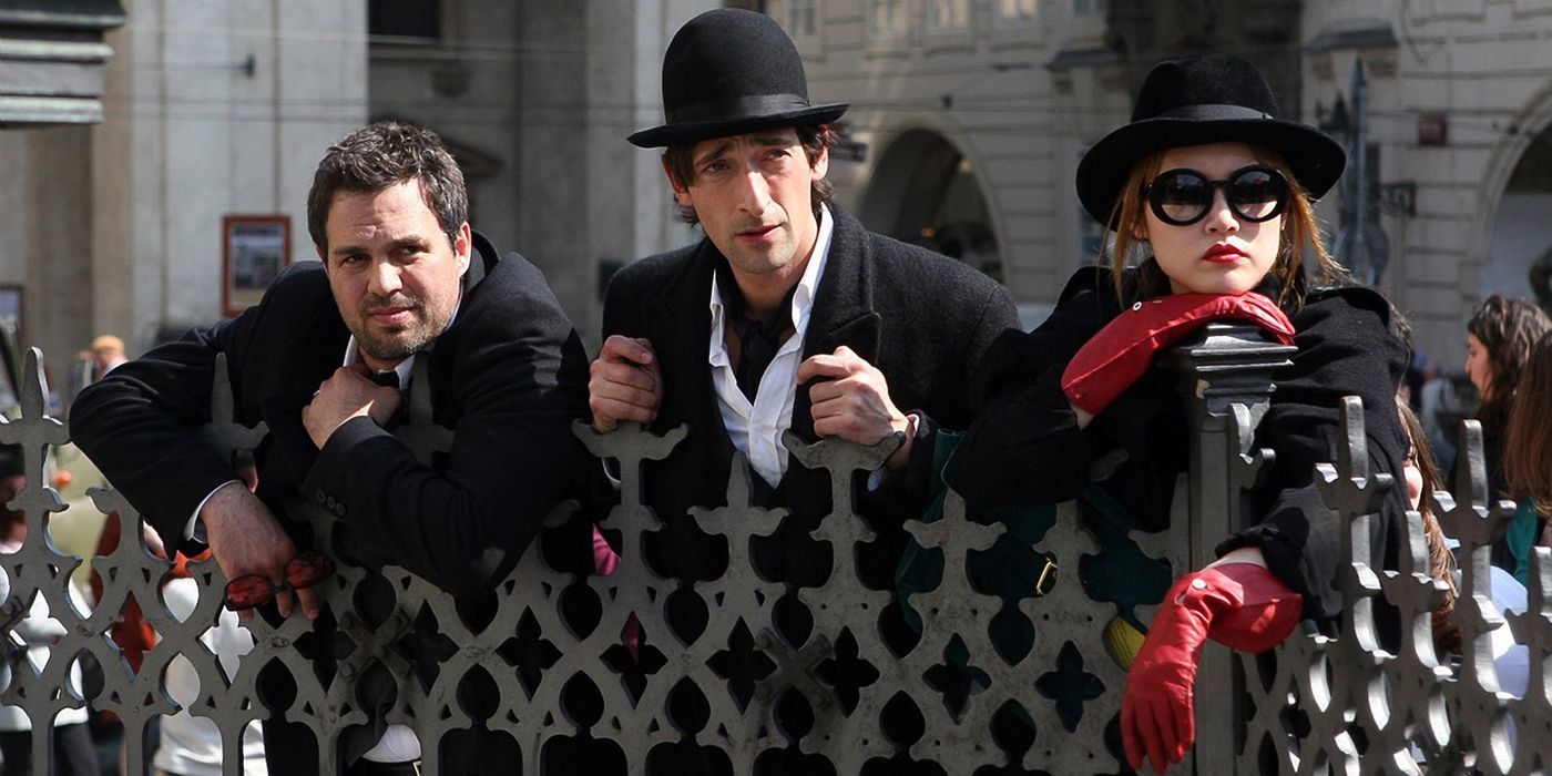 Mark Ruffalo Adrien Brody and Rinko Kikuchi in Brothers Bloom looking over a fence together