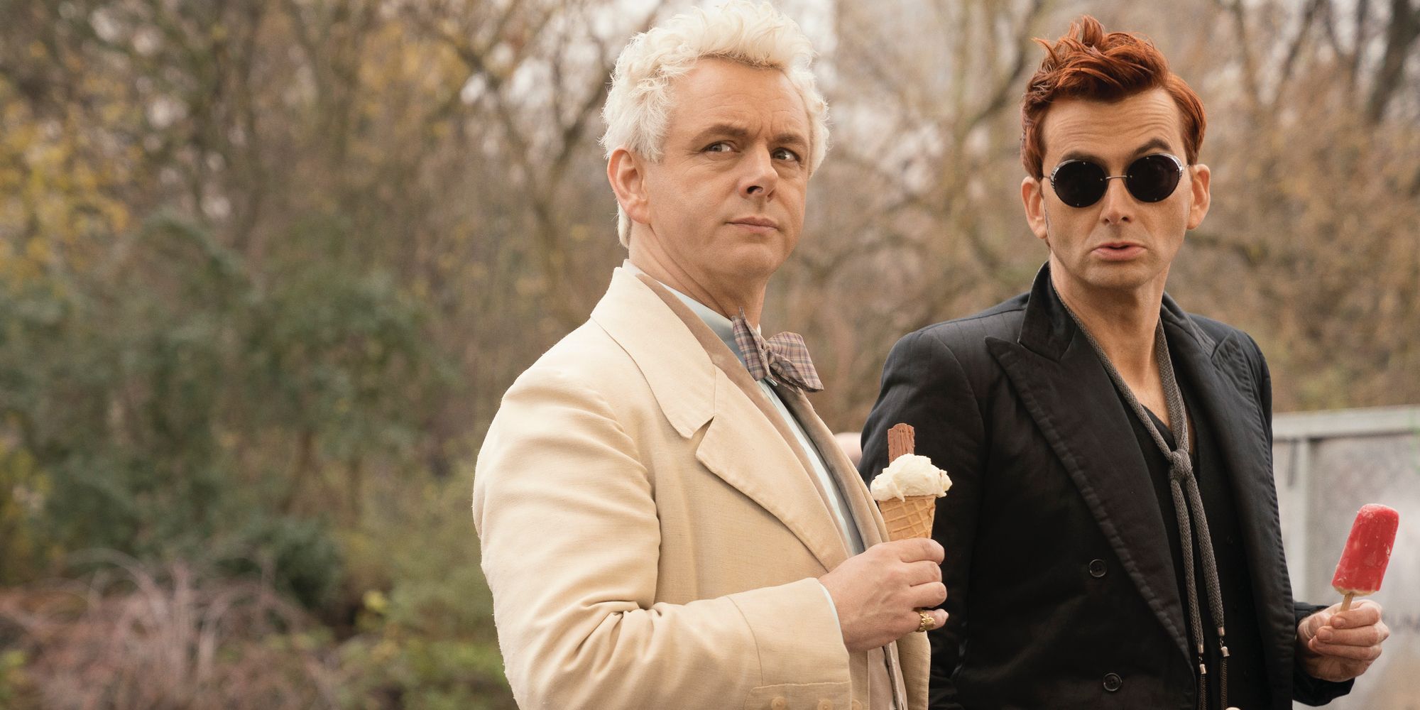 Michael Sheen and David Tennant eating ice cream in a park in Good Omens
