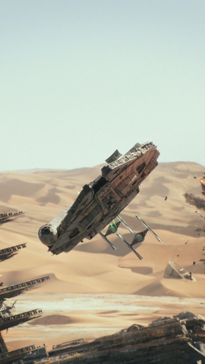 The Millennium Falcon chased by TIE Fighters in Star Wars