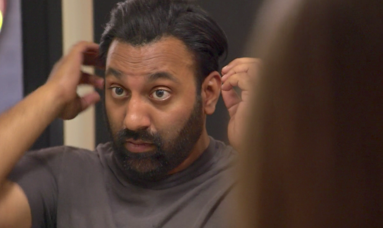 Neal Reddy in Queer Eye Season 1 looking in mirror