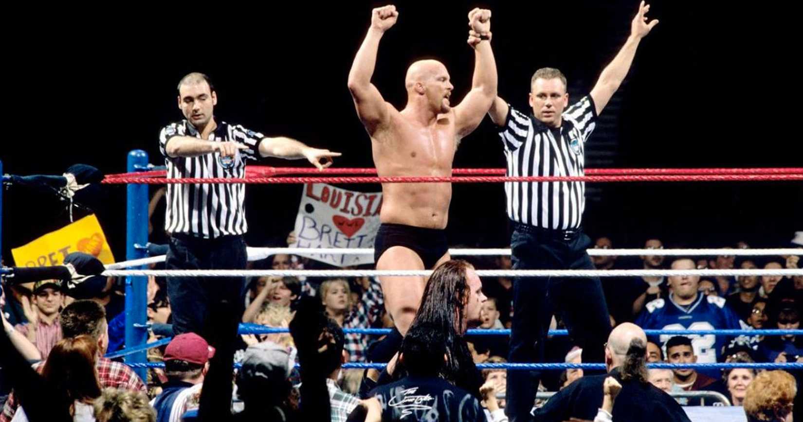 Stone Cold Steve Austin gets his arm raised in a WWE ring