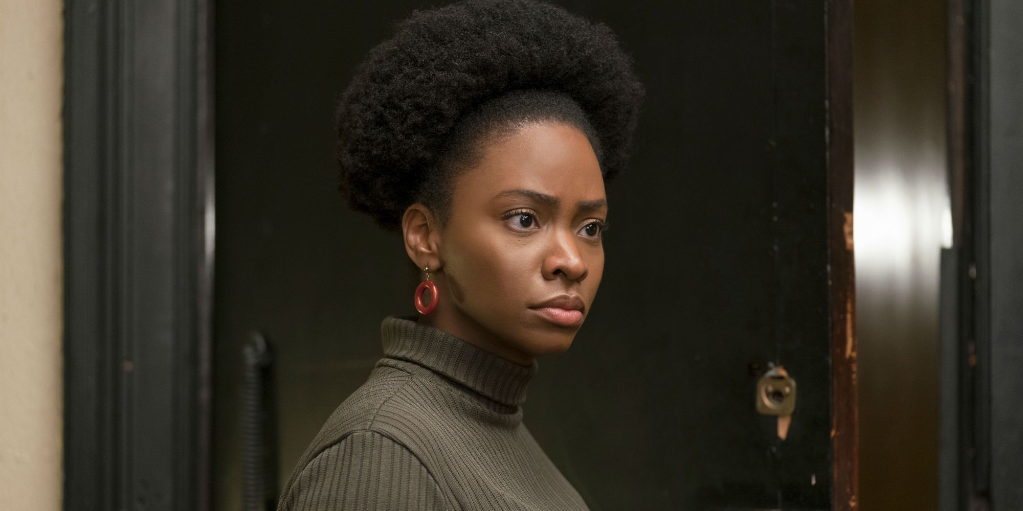 Ernestine turns in the doorway in If Beale Street Could Talk