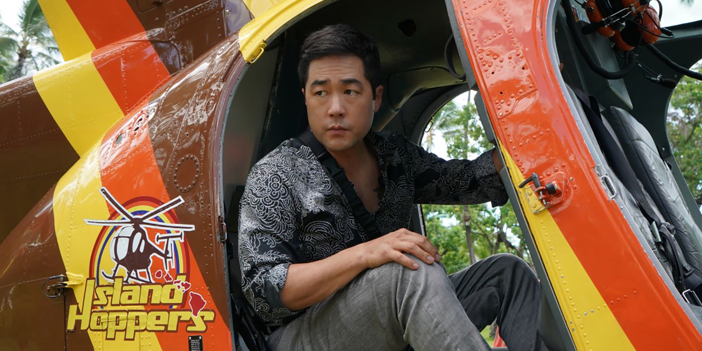 Tim Kang sitting in a helicopter in Magnum P.I.