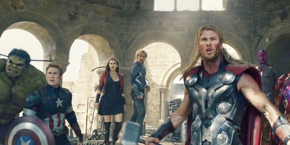 Thor taunting Ultron in the destroyed church in Sokovia surrounded by the other Avengers at the end of Age of Ultron.