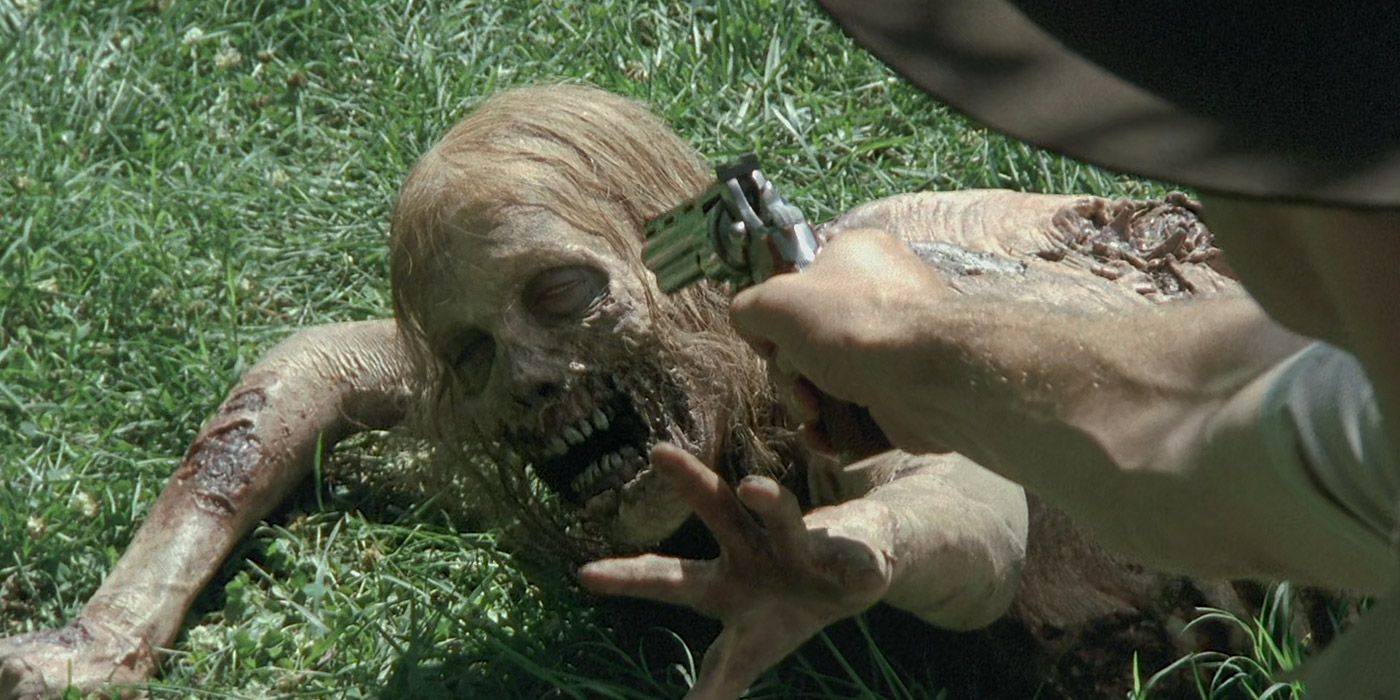 Rick Grimes shoots a zombie in The Walking Dead