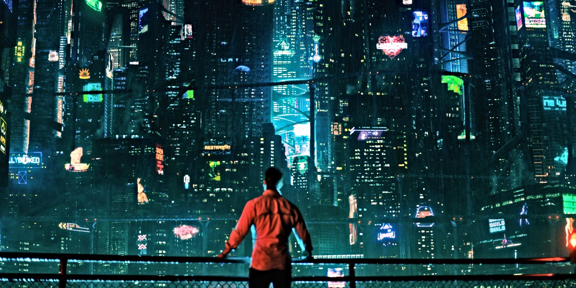 Image of a man standing in front of a futuristic city scape