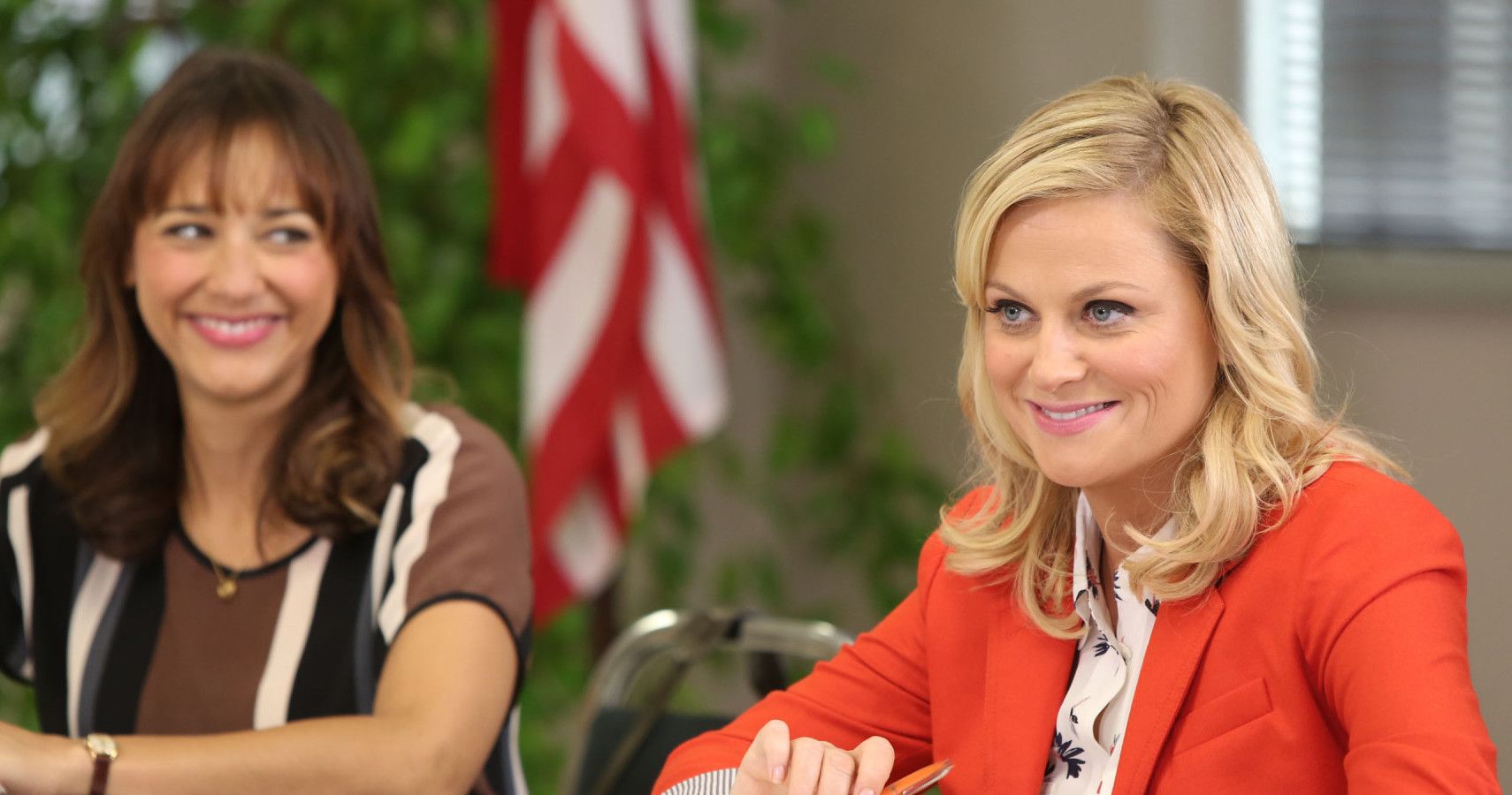 Parks & Recreation - Leslie and Ann smiling at a meeting