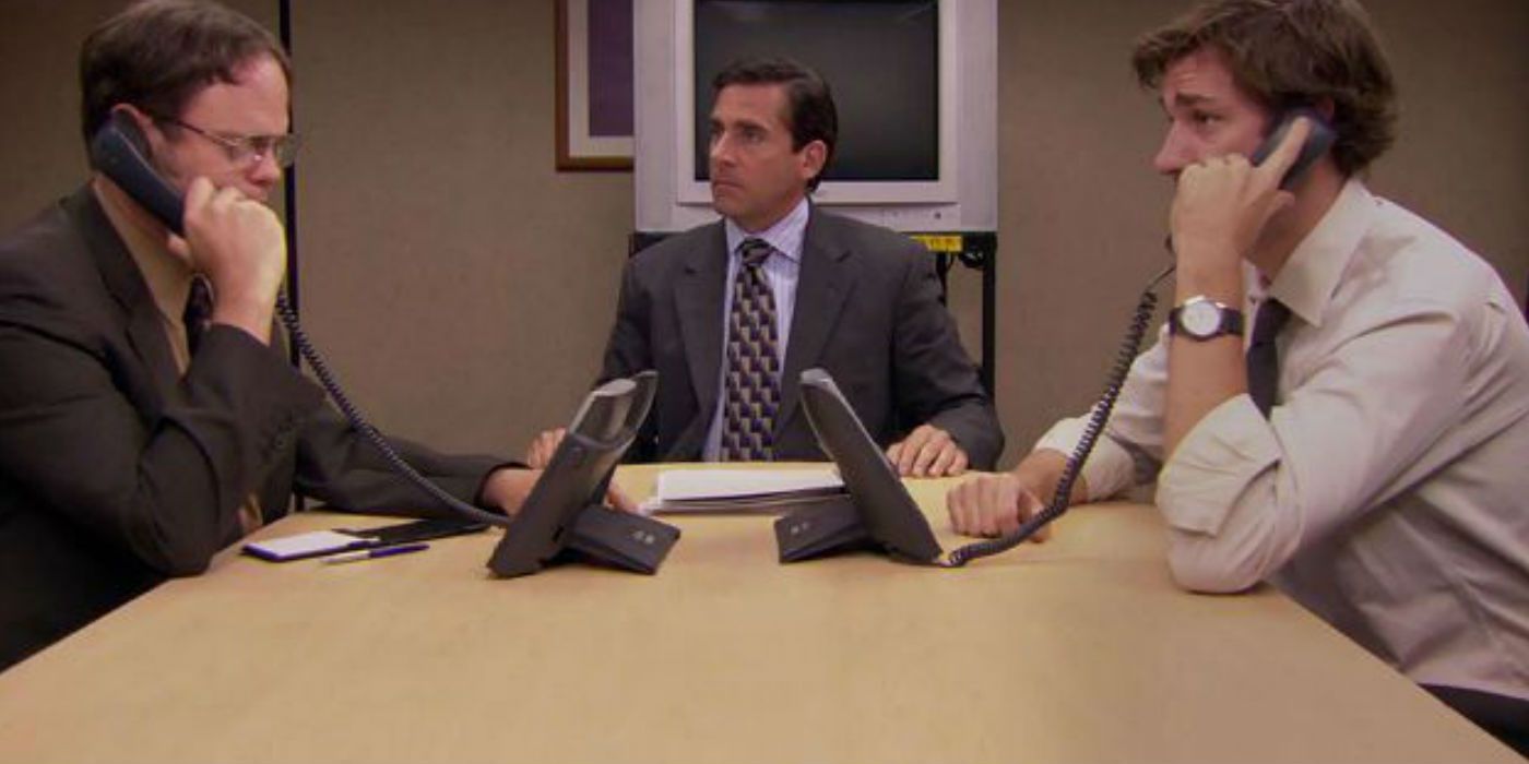Jim (John Krasinski) and Dwight (Rainn Wilson) roleplaying on the phone in the meeting room in The Office