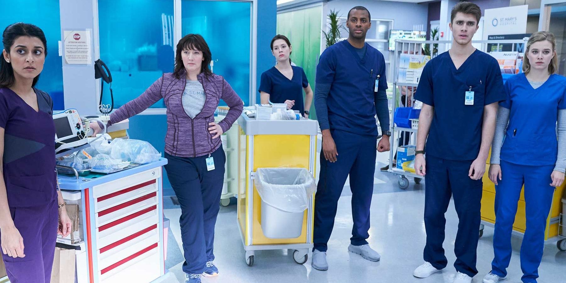 Cast for NBC Nurses standing in the hospital