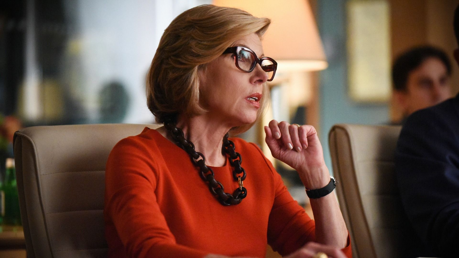 Christine Baranski as Diane in The Good Wife seated at conference table