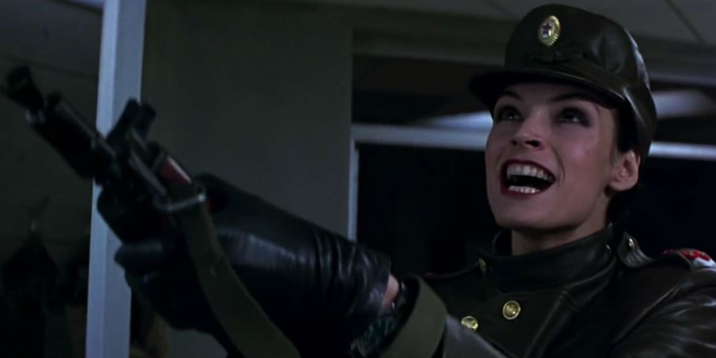 Famke Janssen as Xenia Onatopp firing machine gun in Goldeneye