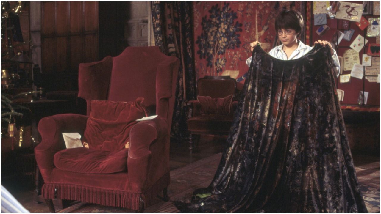 Harry Potter with his Invisibility Cloak