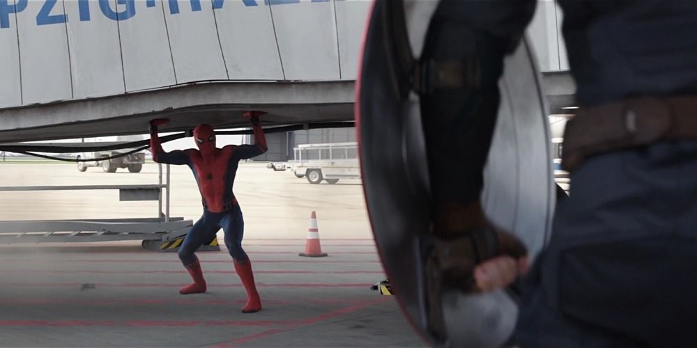 Spider-Man holds up the bridge at the airport in Captain America: Civil War as Steve Rogers looks on