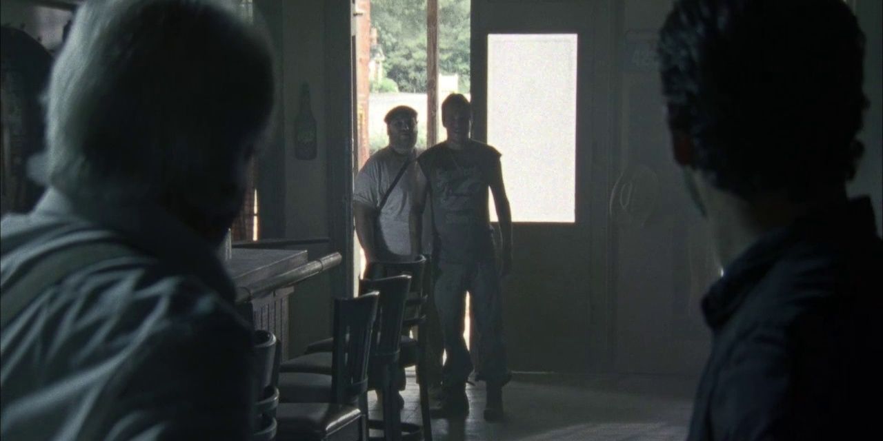 The Living accost Rick, Hershel and Glenn in The Walking Dead