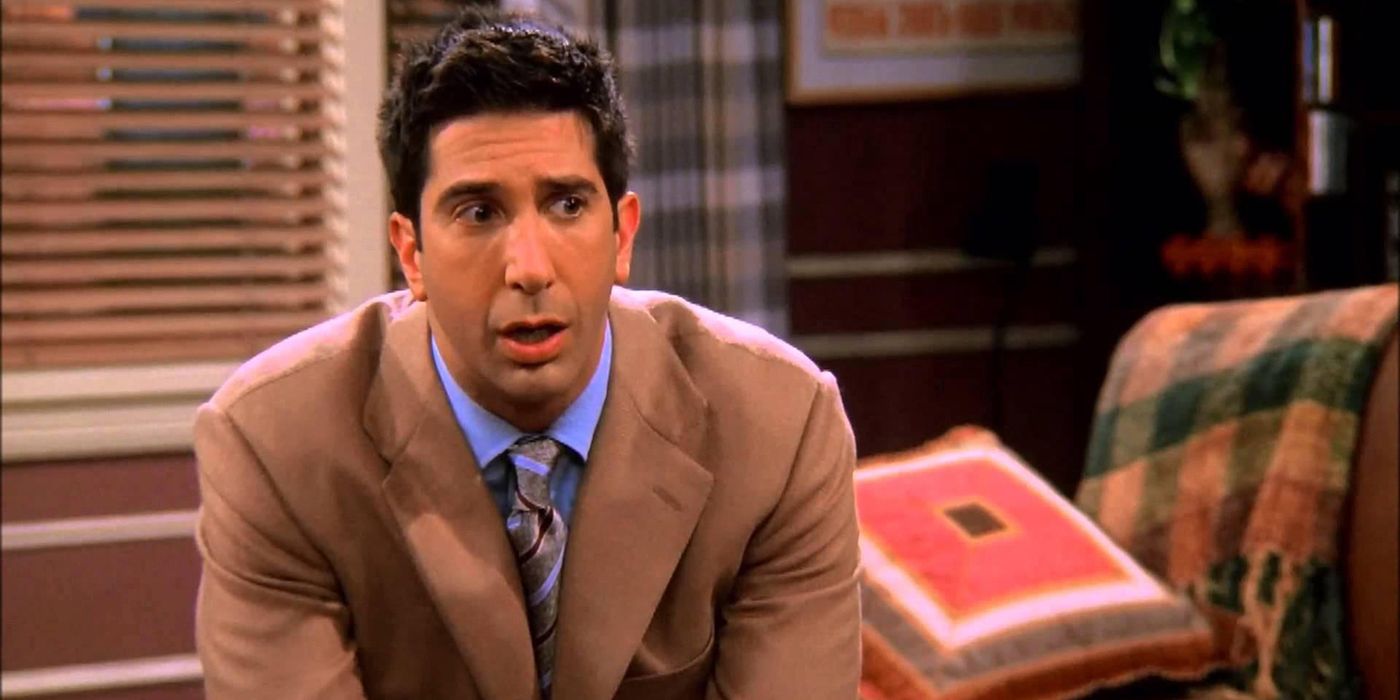 Ross Gellar looks shooketh while wearing a tan suit on Friends.