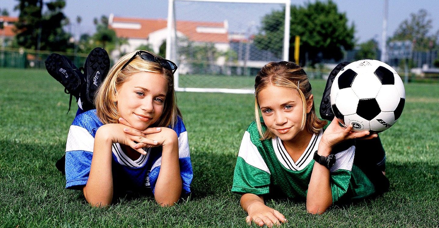 Mary-Kate and Ashley posing in soccer gear for Switching Goals