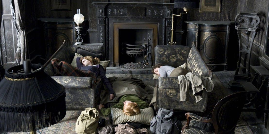 The golden trio sleeping in Grimmauld Place's dark and dingy living room
