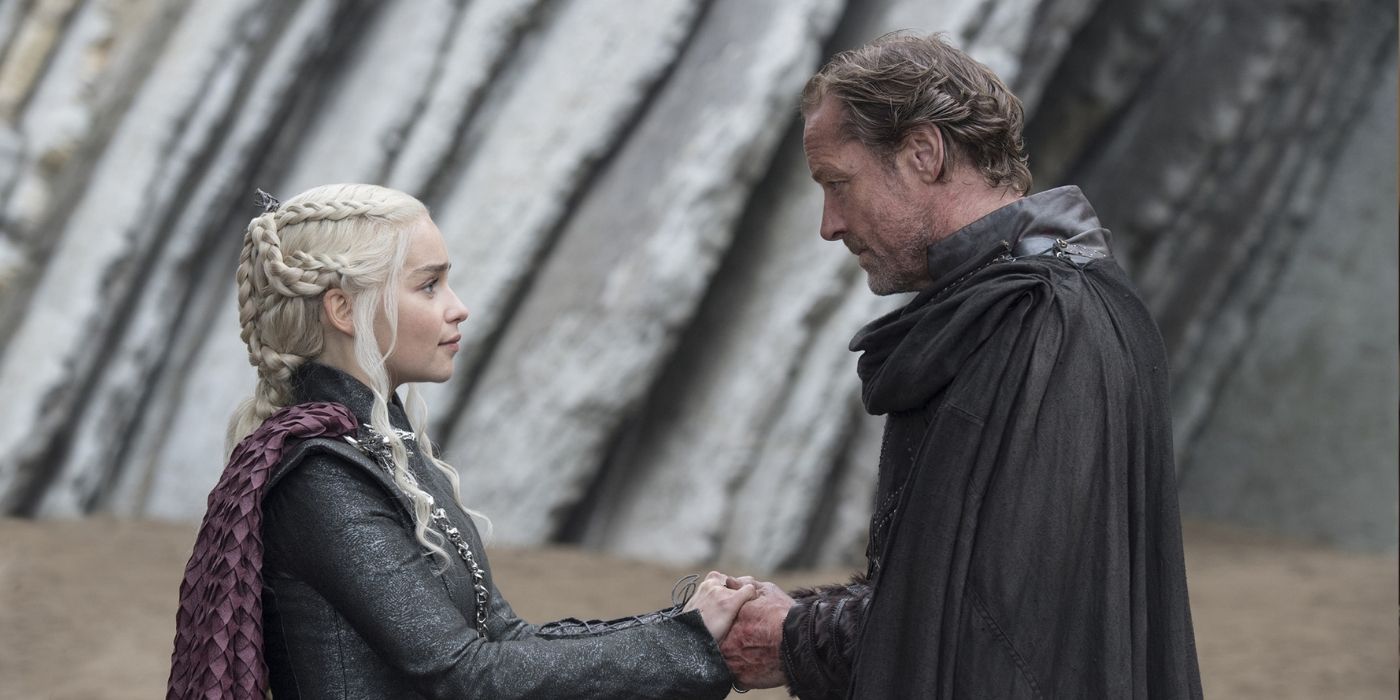 Daenerys and Jorah holding hands after reuniting. 