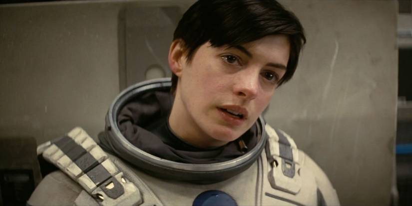 Anne Hathaway as Amelia Brand talking and looking emotional in Interstellar
