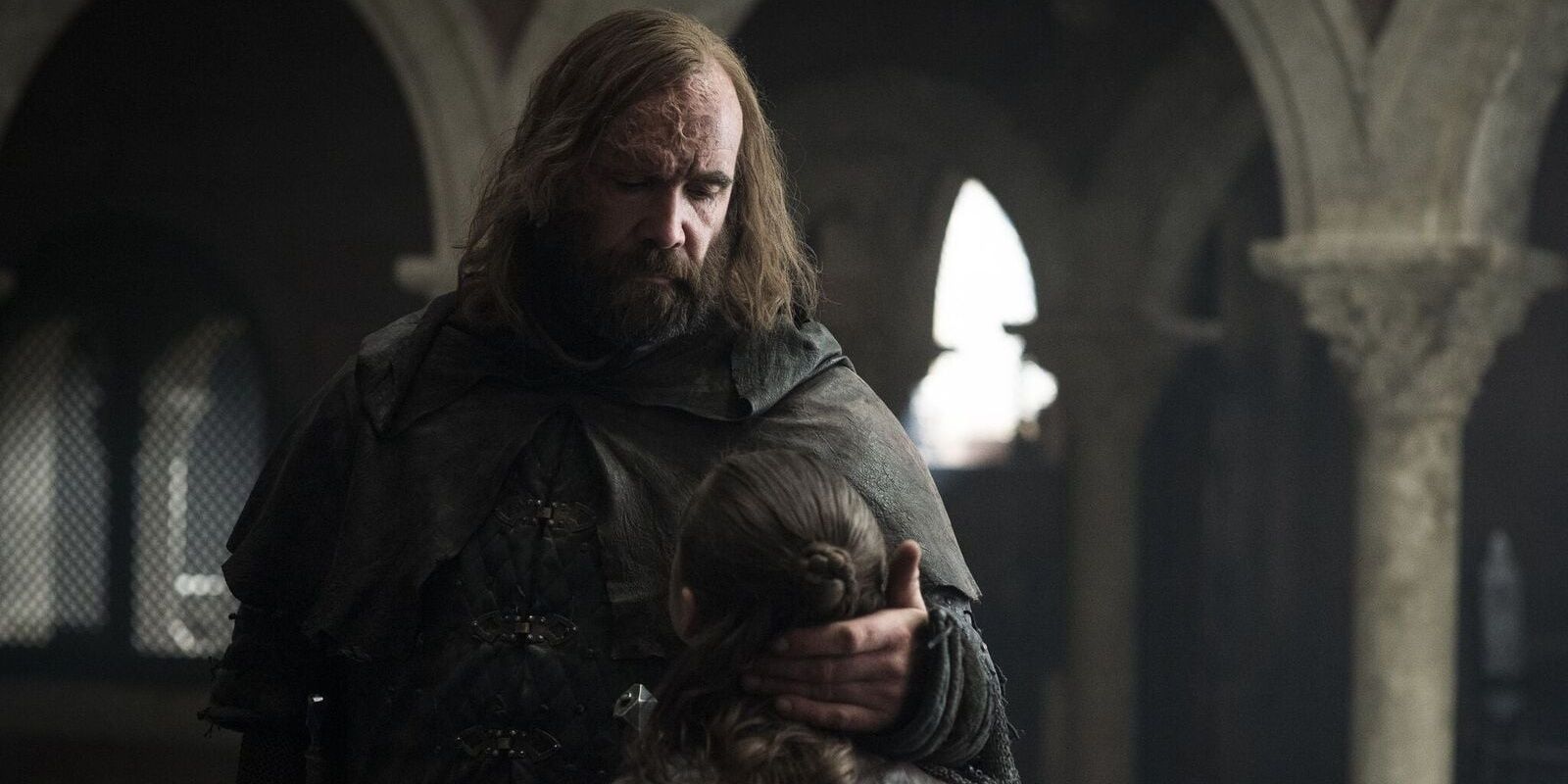 The Hound talking gently to Arya