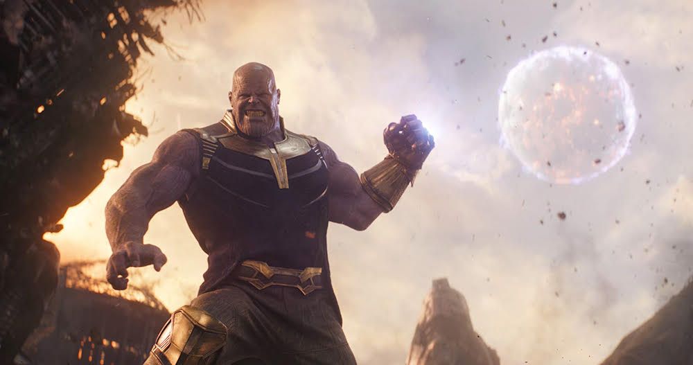 Thanos grimacing and preparing to strike with the Infinity Gauntlet 