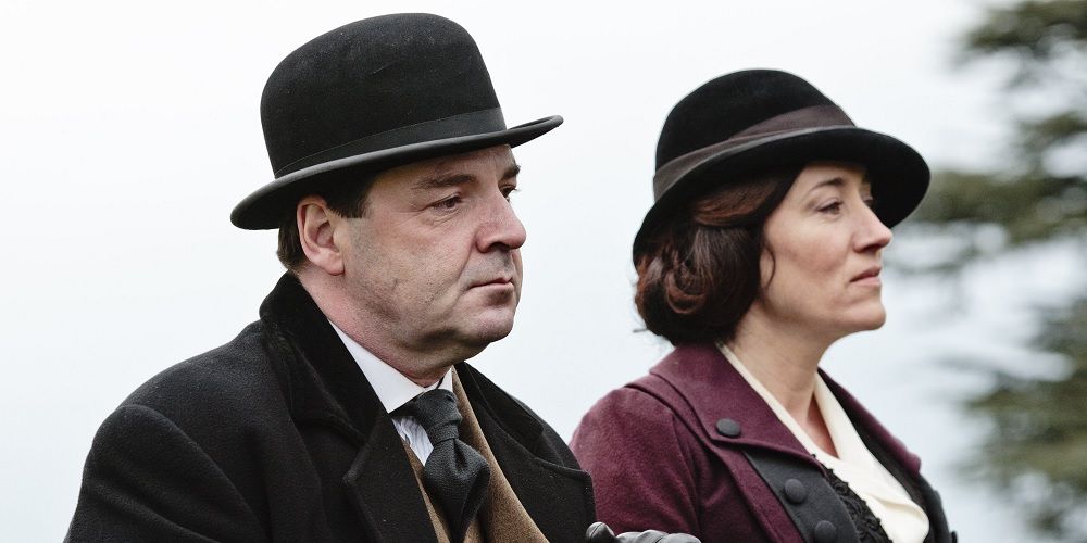 John and Vera stand next to each other in Downton Abbey.
