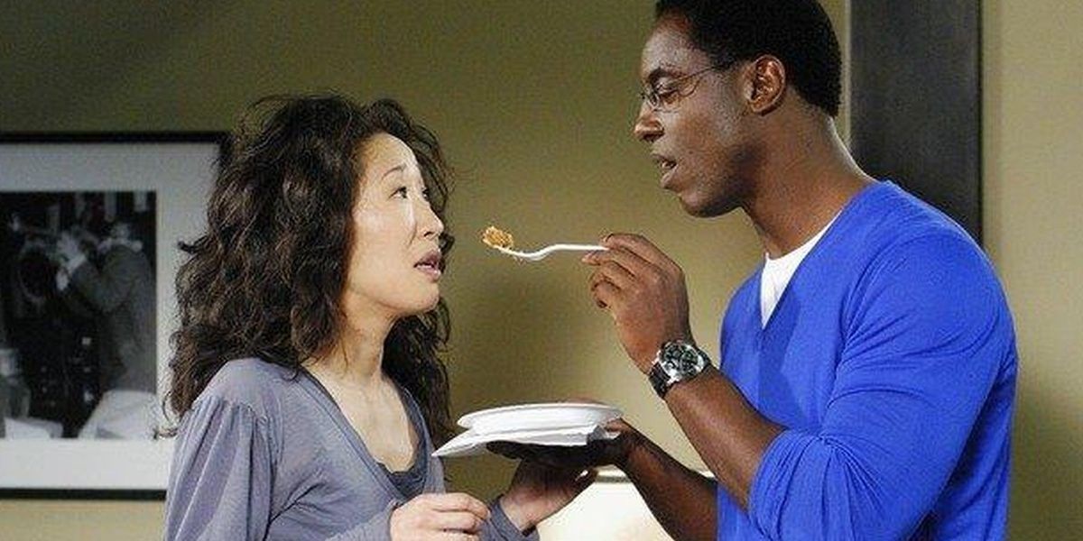 Burke feeding Cristina Grey's Anatomy