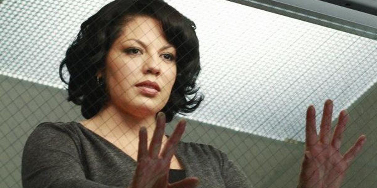 Callie in musical episode looking from gallery in Grey's Anatomy