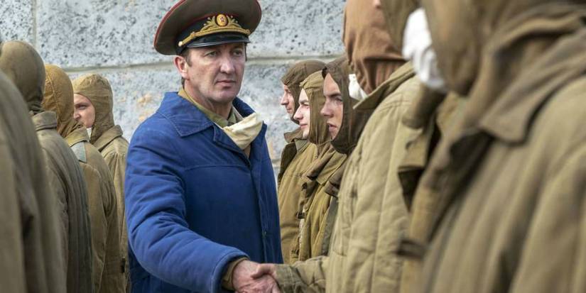 A military official shakes hands with soldiers in Chernobyl