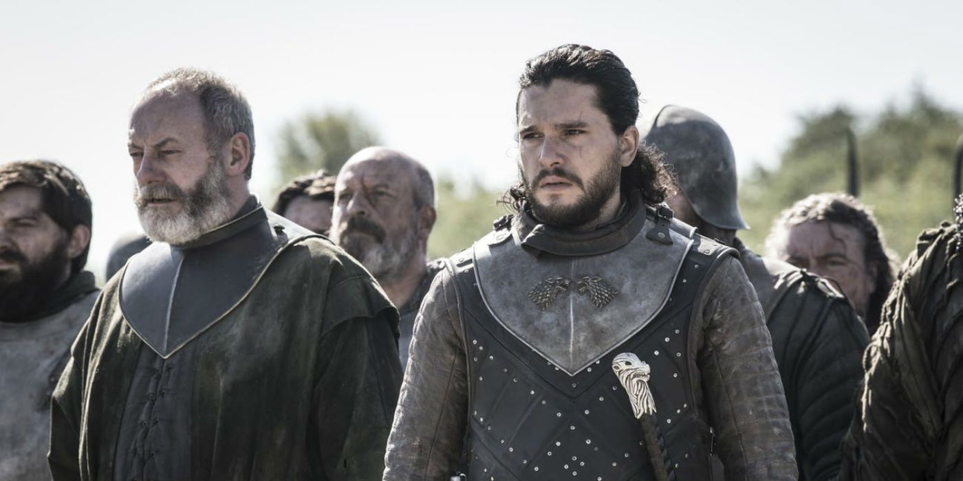 Jon Snow and Davos in front of a crowd