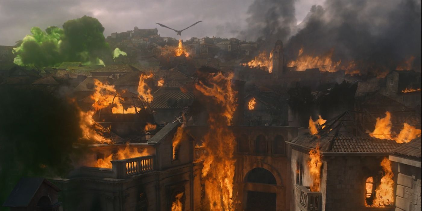 King's Landing burning and a dragon flying in the sky