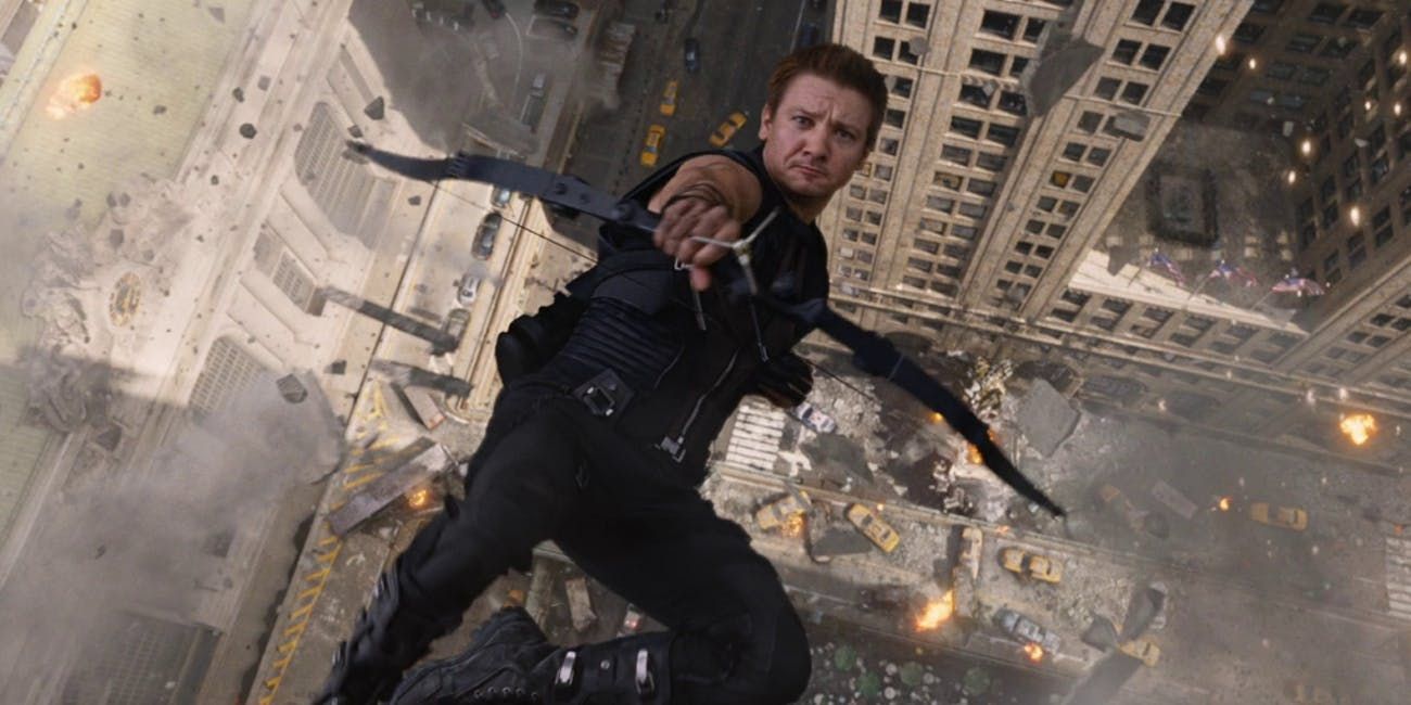 Hawkeye falling through the air as he fires an arrow from his bow in The Avengers