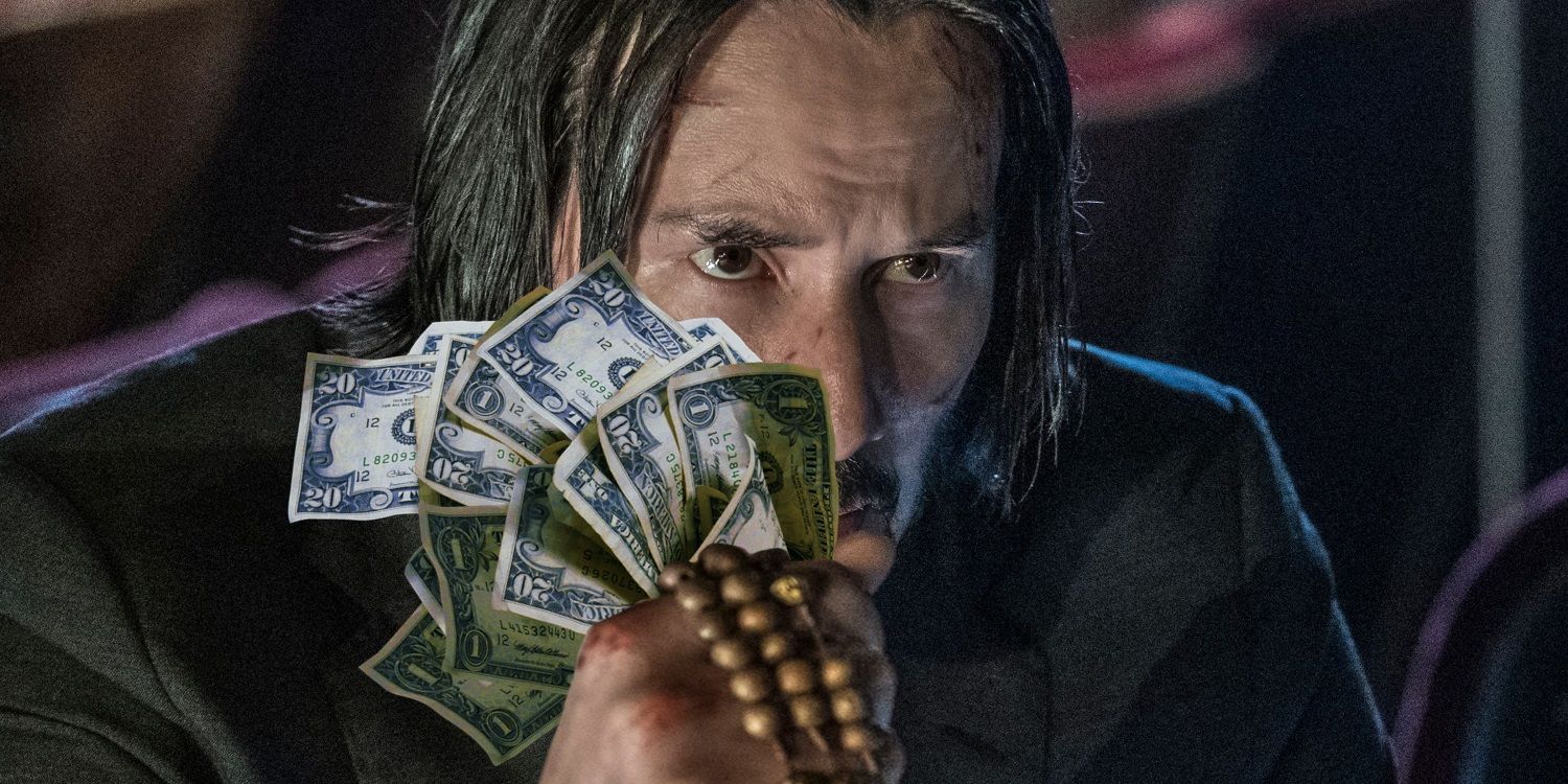 An image of John Wick holding a lot of cash