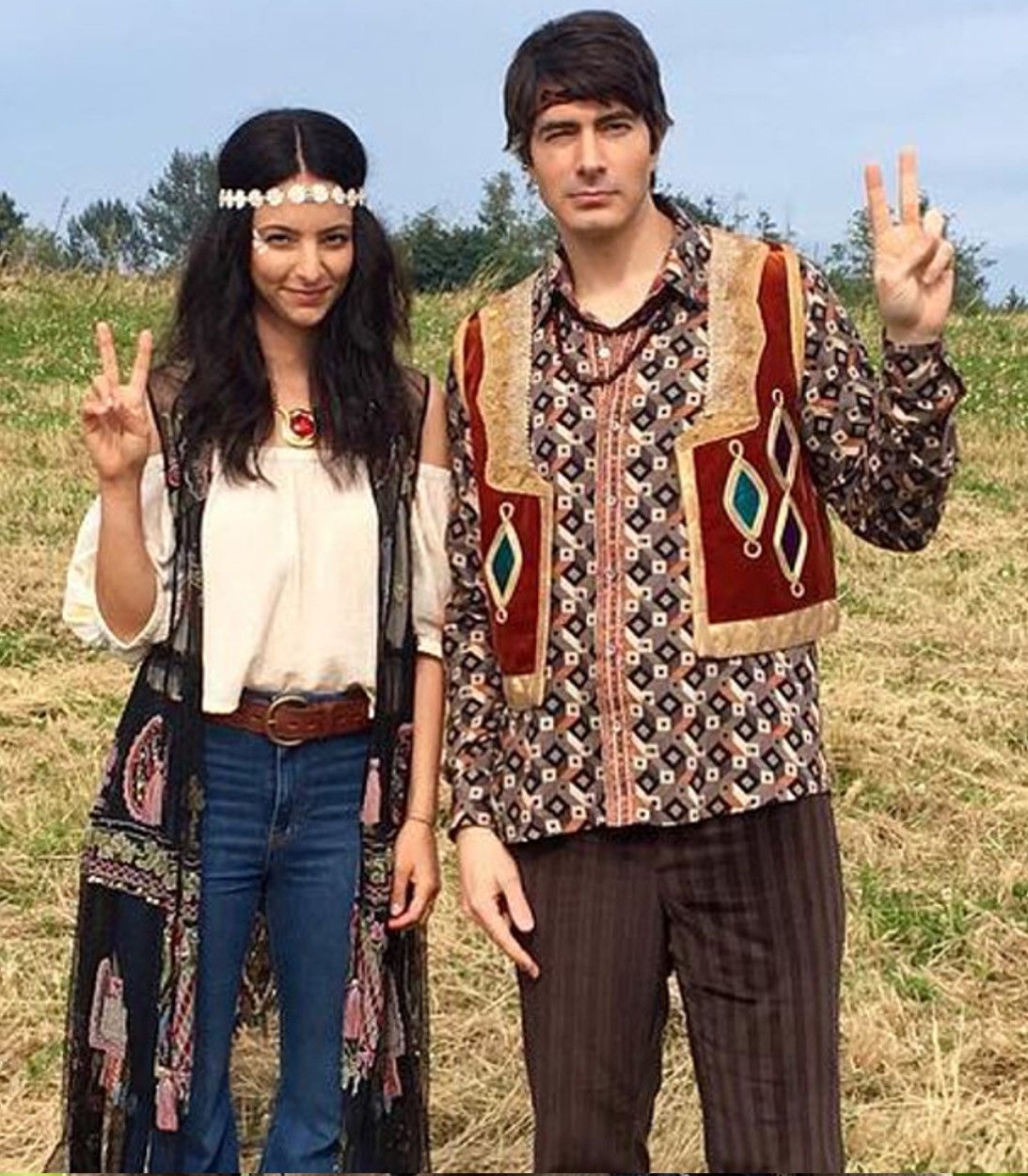 Legends of Tomorrow Zari Tomaz and Ray Palmer Dressed As Hippies At Woodstock vertical