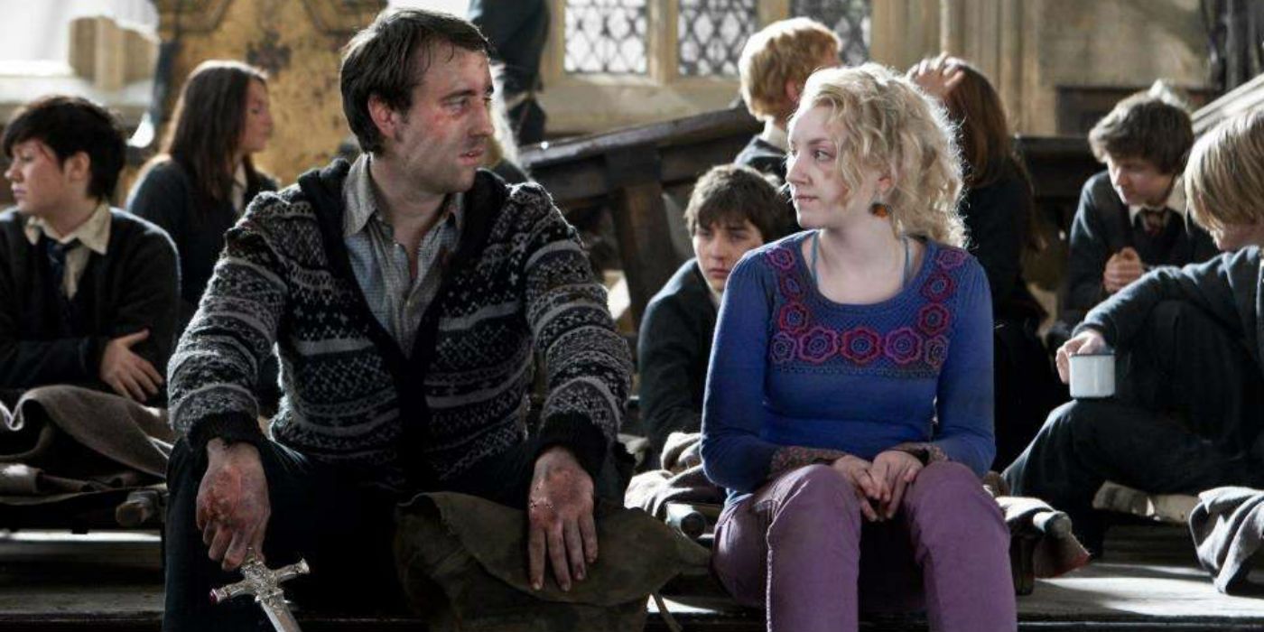 Neville and Luna sit in the Great Hall after the Battle of Hogwarts in Harry Potter and the Deathly Hallows