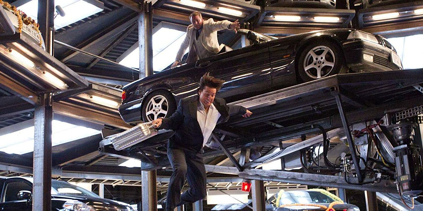 Ethan Hunt jumps down from platform in car park in Mission: Impossible - Ghost Protocol