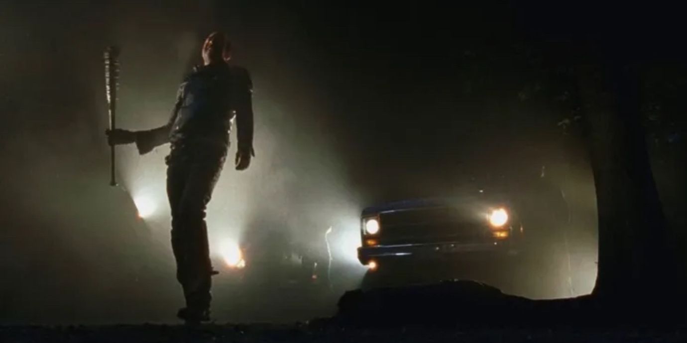 Negan stood in the headlights of a car in The Walking Dead