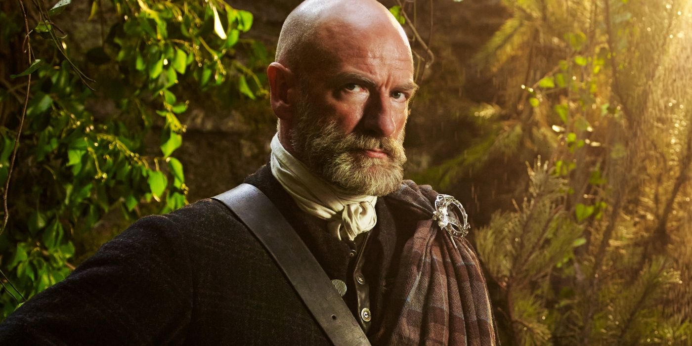 Dougal Mackenzie looking seriously at the camera in Outlander