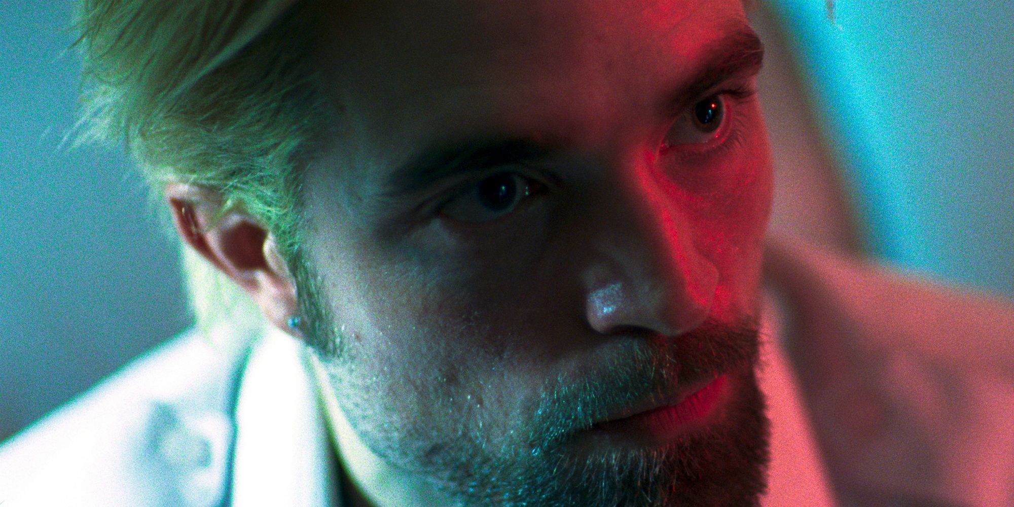 Robert Pattinson looks to his side in Good Time.