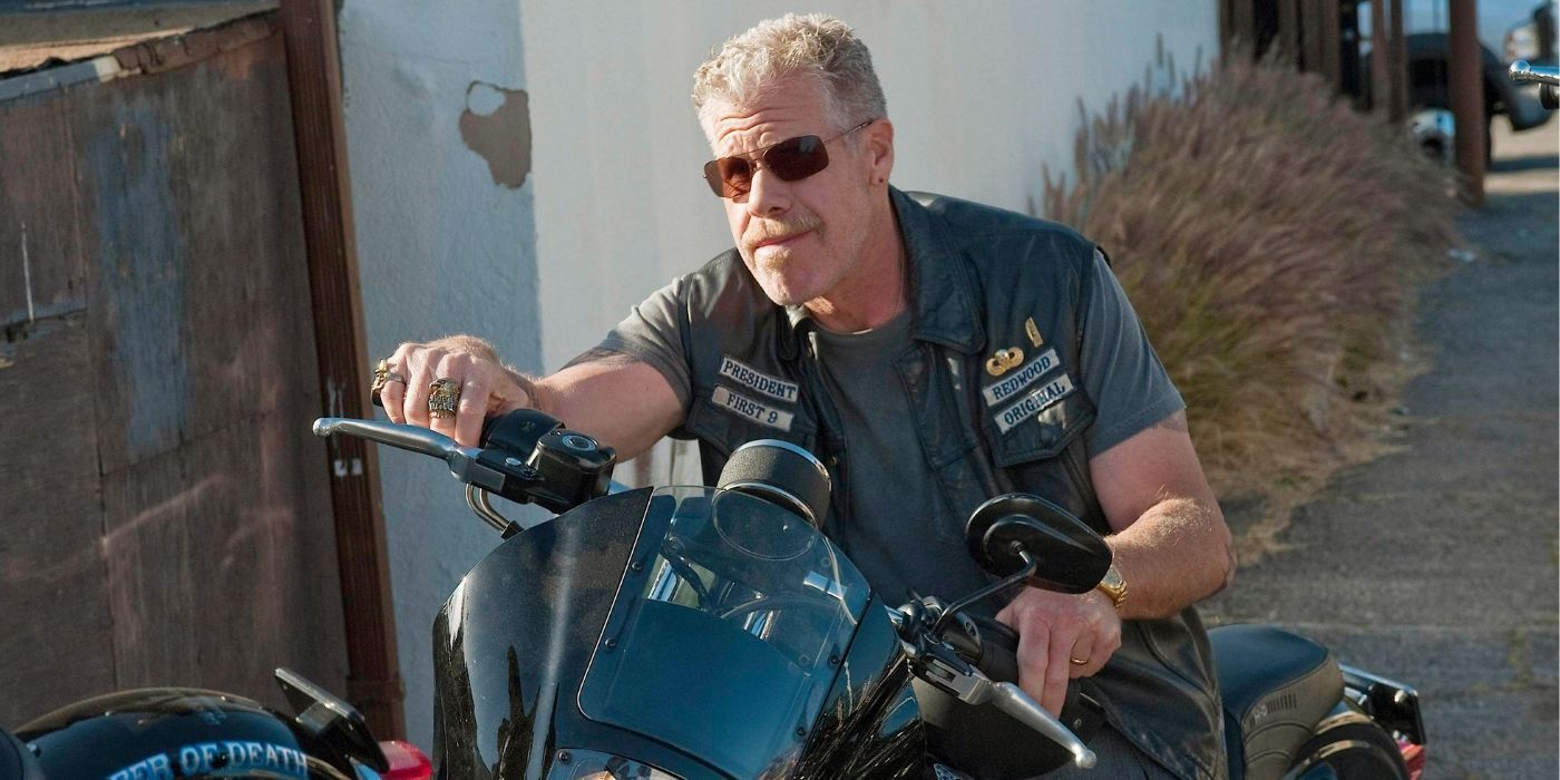 Clay Morrow starts his motorcycle outside the clubhouse