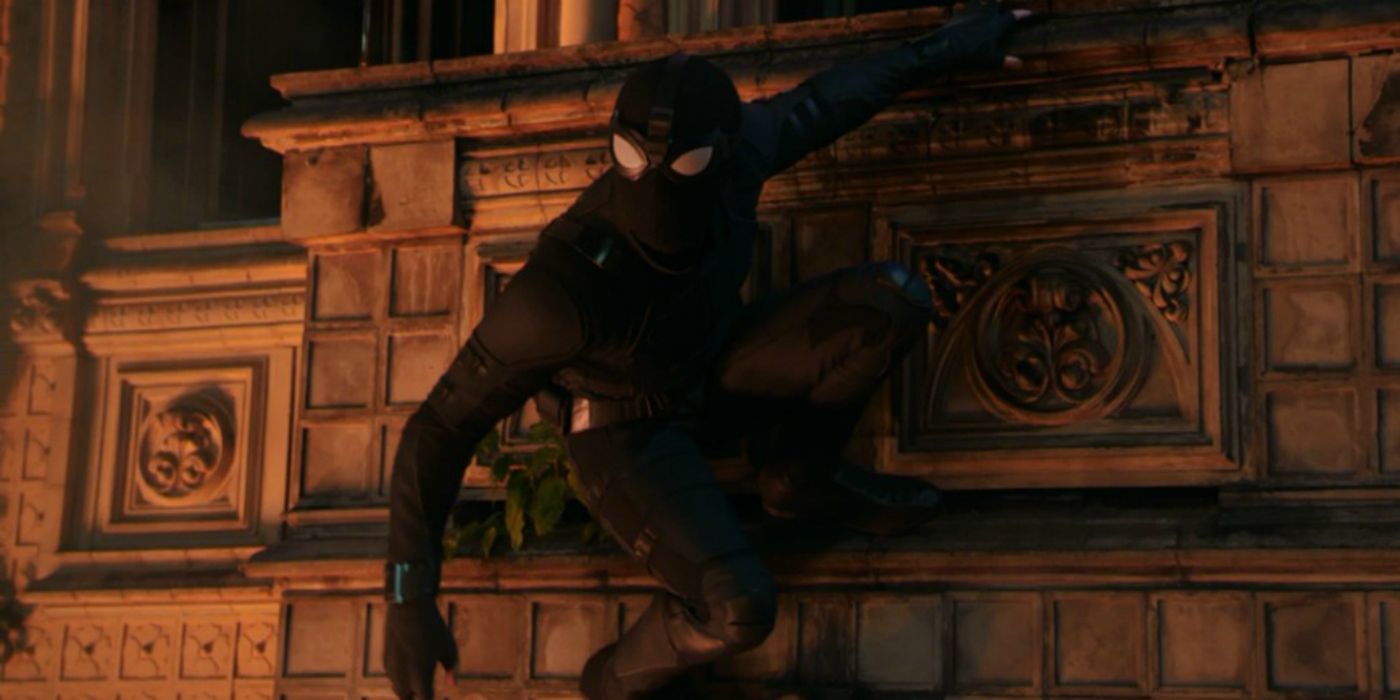 Peter Parker holds onto a wall in the stealth suit in Spider-Man: Far From Home