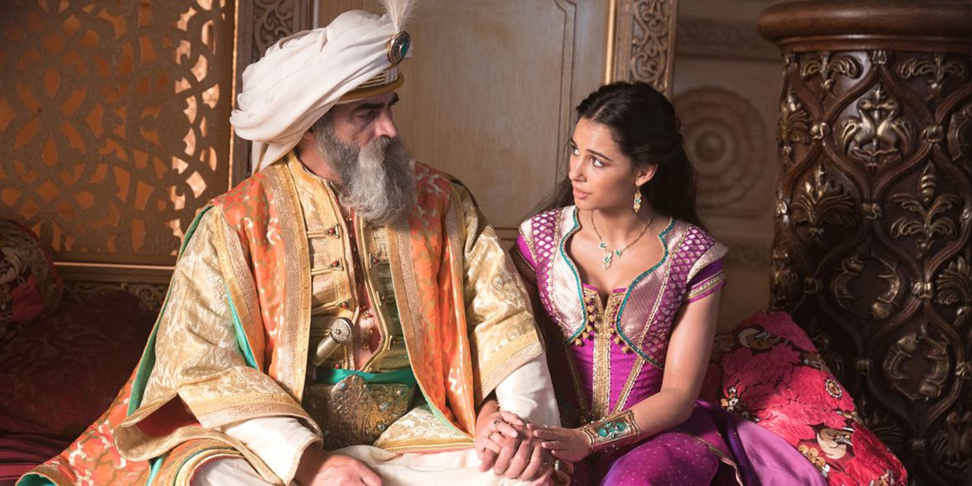 The sultan sits with Jasmine in Alladdin
